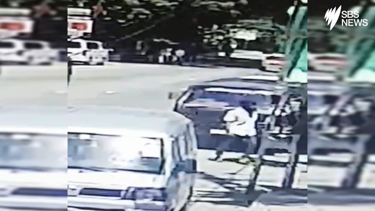 A man understood to be Abdul Latif Jameel Mohammed, in white, caught on CCTV outside the Tropical Inn guest house.