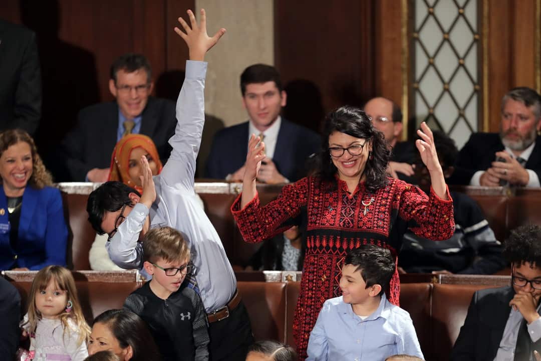 Rashida Tlaib (right) votes for Speaker-designate Rep. Nancy Pelosi (D-CA) along with her kids during the first session of the 116th Congress.