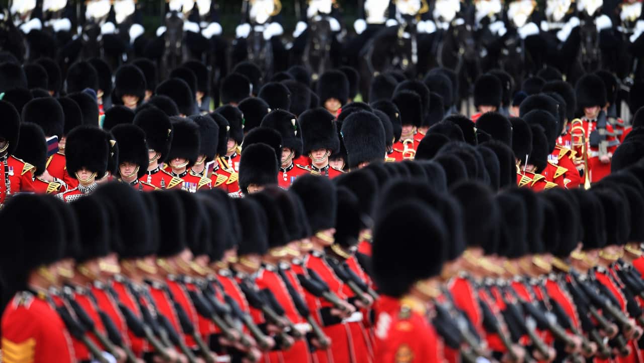 Britain's Queen's Guards march at the Horseguards Parade for the annual Trooping of the Colour in London.