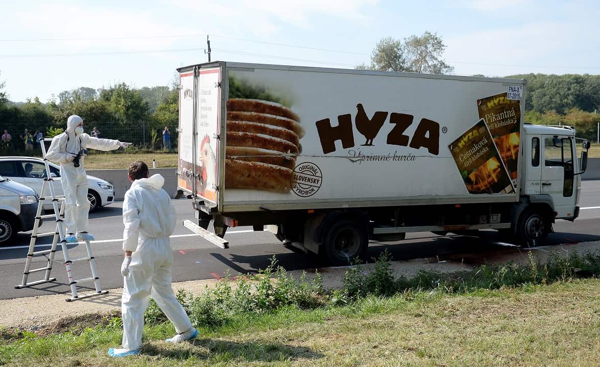 August 2015: Forensic experts investigate a truck in which refugees were found dead on freeway autobahn A4 between Parndorf and Neusiedl, Austria.