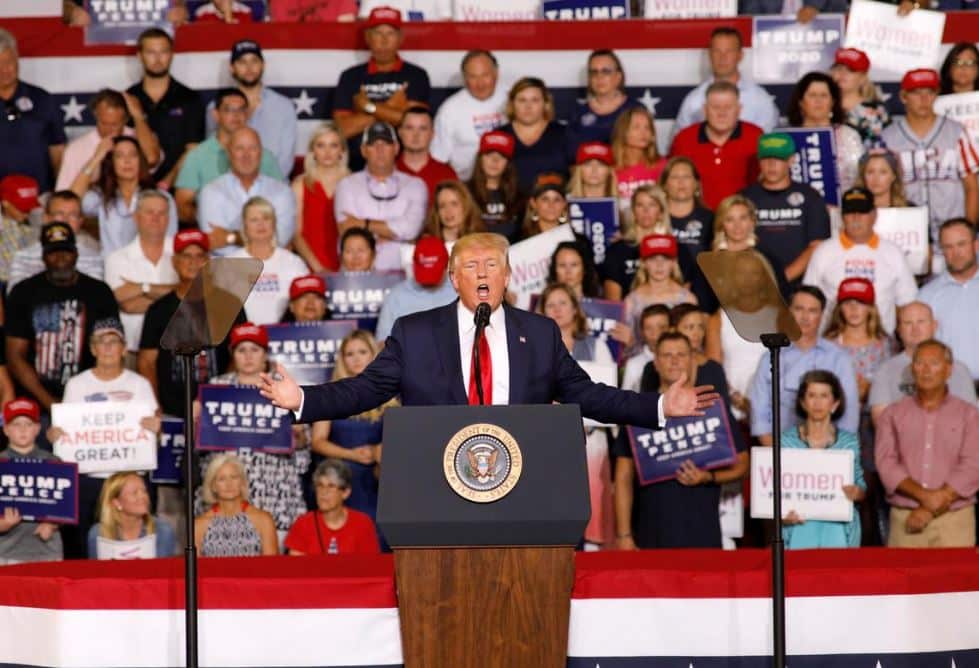 US President Donald Trump addresses the crowd of a rally as supporters chant "send her back".