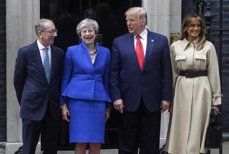 Britain's Prime Minister Theresa May and her husband Philip greet President Donald Trump and first lady Melania outside 10 Downing Street. 
