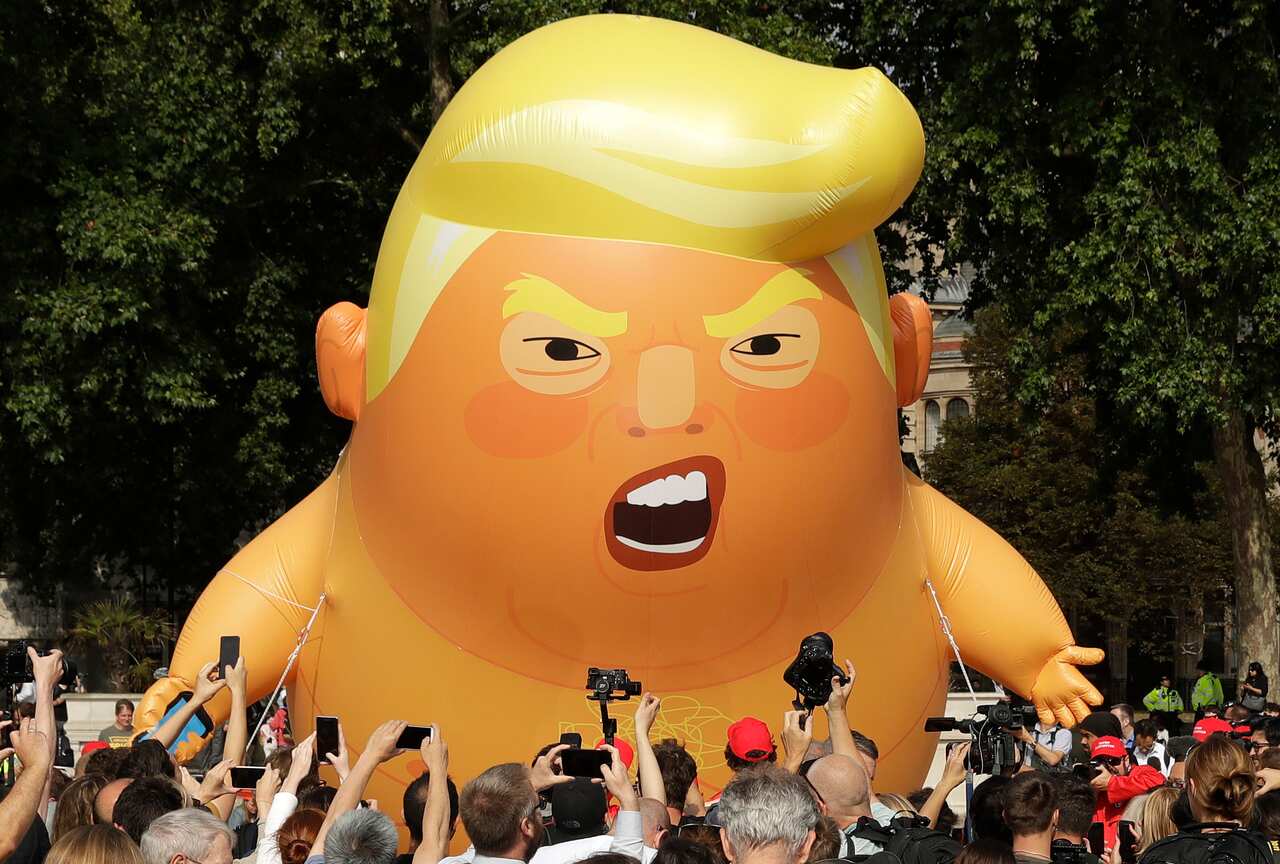 The Baby Trump Blimp flies over Parliament Square last year. The blimp is set for a return. 