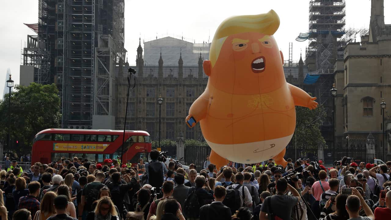 The 'Donald Trump Baby Blimp' balloon flies over Parliament Square during a protest in London, Britain, 13 July 2018.