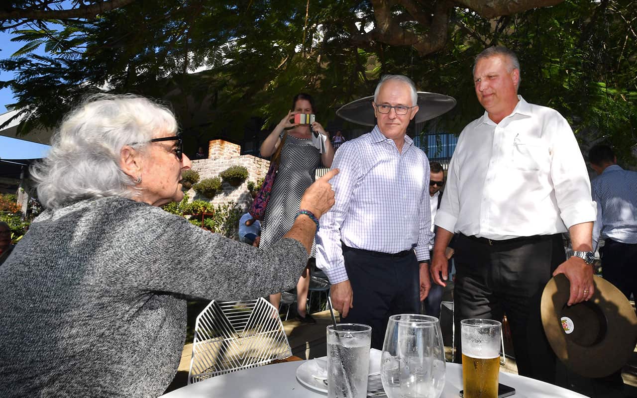 Local resident Toni Lea (left) is seen gesturing at Prime Minister Malcolm Turnbull (centre) and Trevor Ruthenberg on Friday at Sandstone Point.