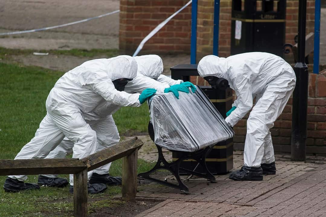 Army officers remove the bench, where Sergei Skripal and his daughter were found, in Salisbury.