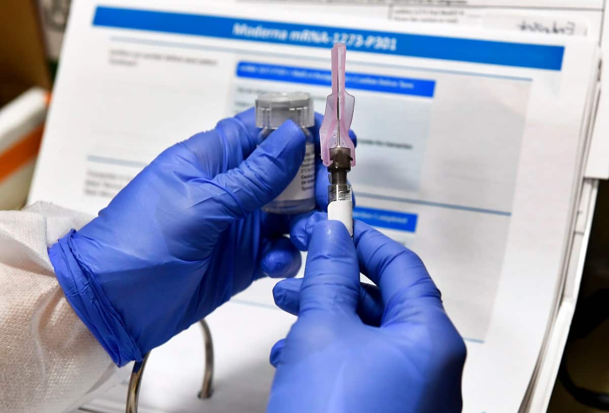 Registered Nurse Kath Olmstead prepares  a blinded study experimental vaccine for COVID-19.