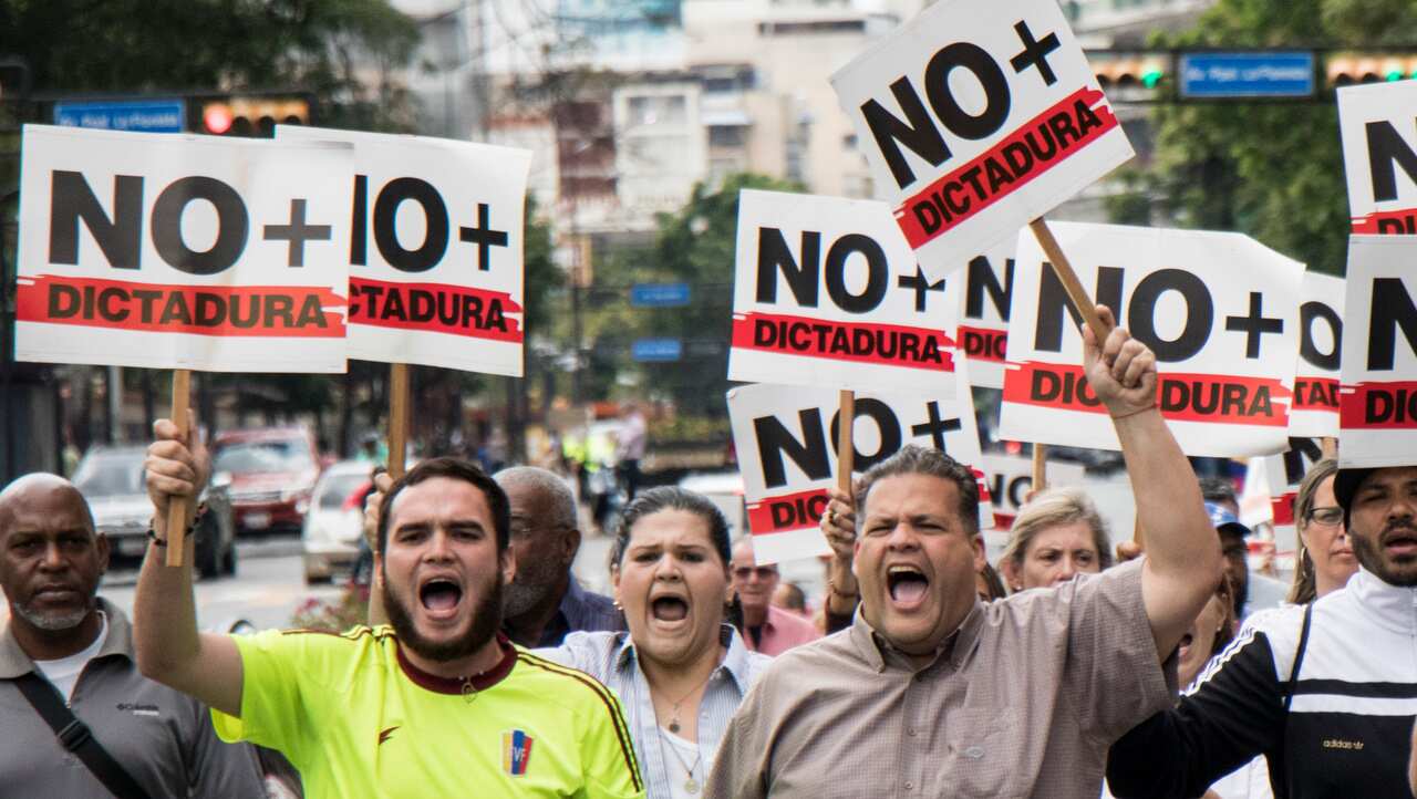 Opposition demonstrators take part in protest against the government of President Nicolas Maduro, called by Juan Guaido on 30/1/19.