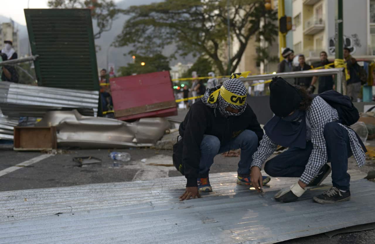 Protestors set-up street barricades.