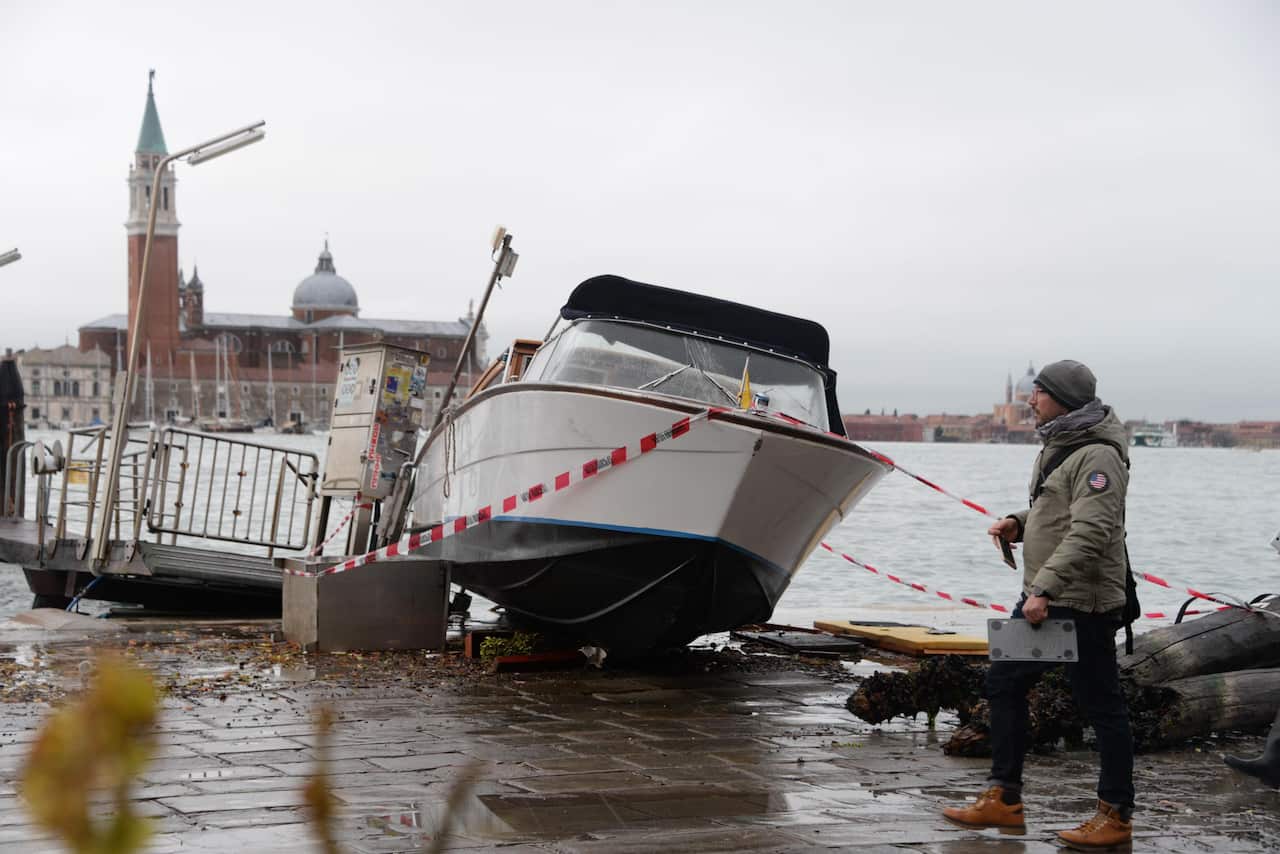 A stranded boat in Venice after the extremely high tide.