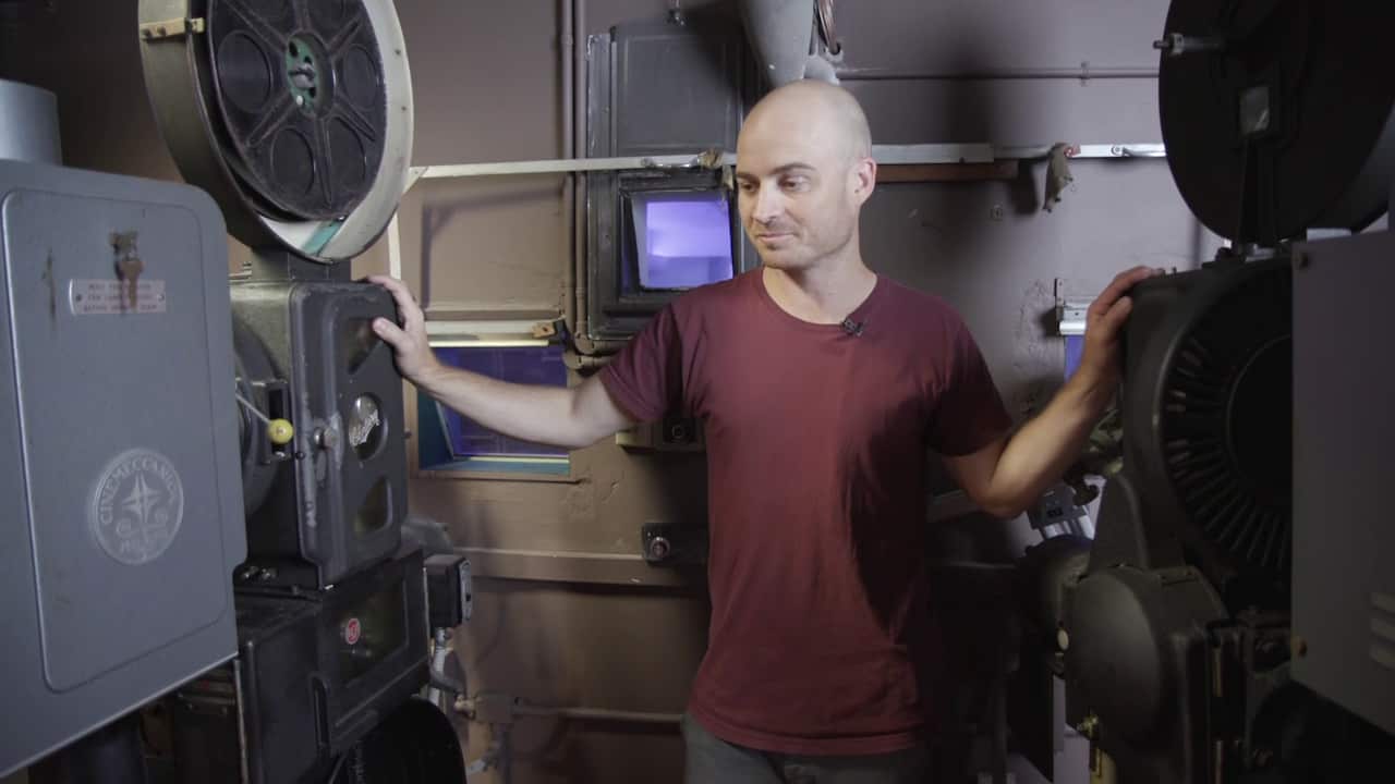 Bob Barton with the original cinema projectors