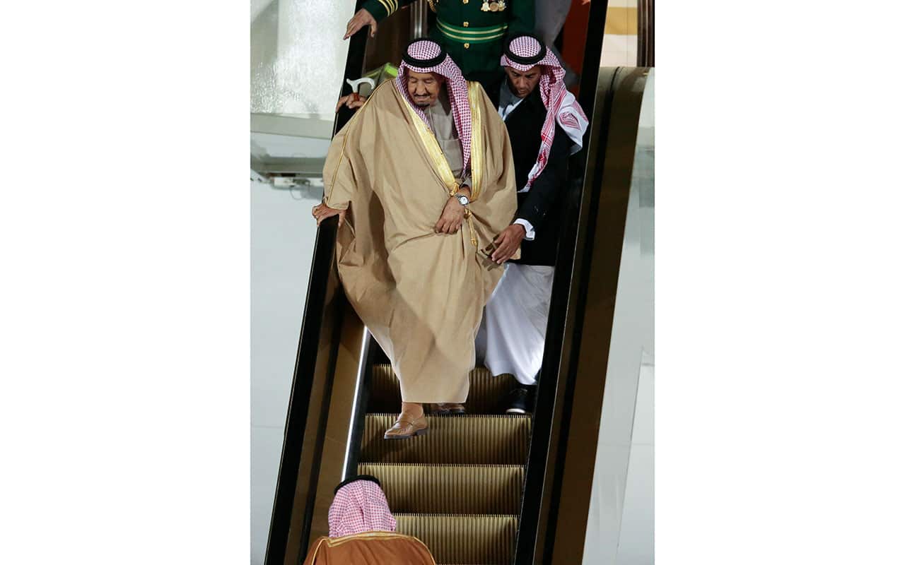 Saudi Arabia King Salman bin Abdulaziz Al Saud (front) steps down from his plane upon his arrival in Moscow.