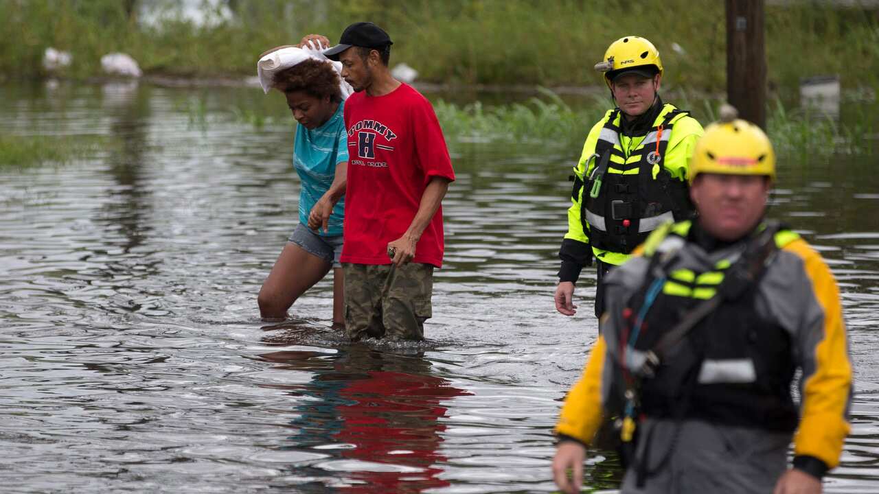 Members of the Greenville Fire Department swift water team go house to house following Hurricane Florence.