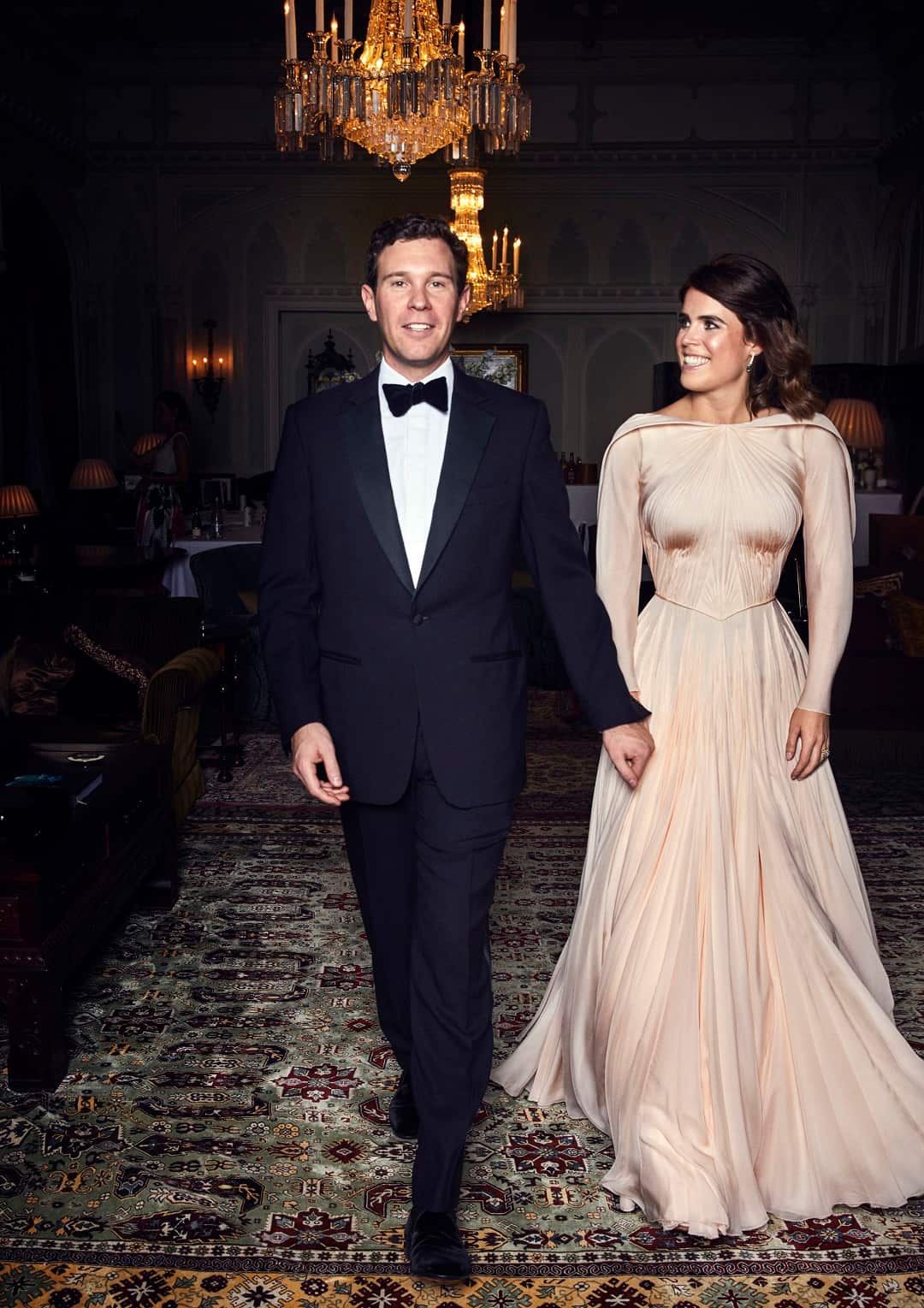 Eugenie wears a Zac Posen dress with earrings given to her by the groom.