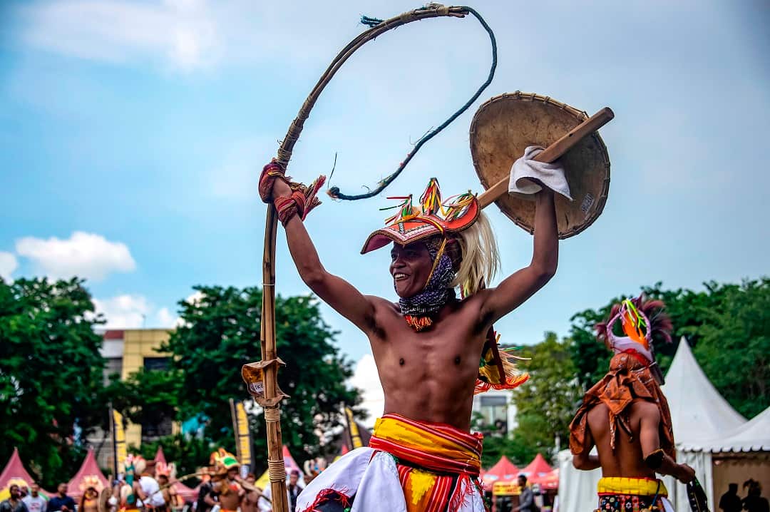 A Caci fighter with his whip and shield for doing battle in Surabaya, East Java province. 
