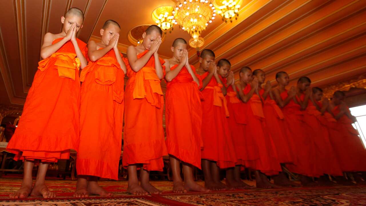 Members of Wild Boars football team during a prayer ceremony.