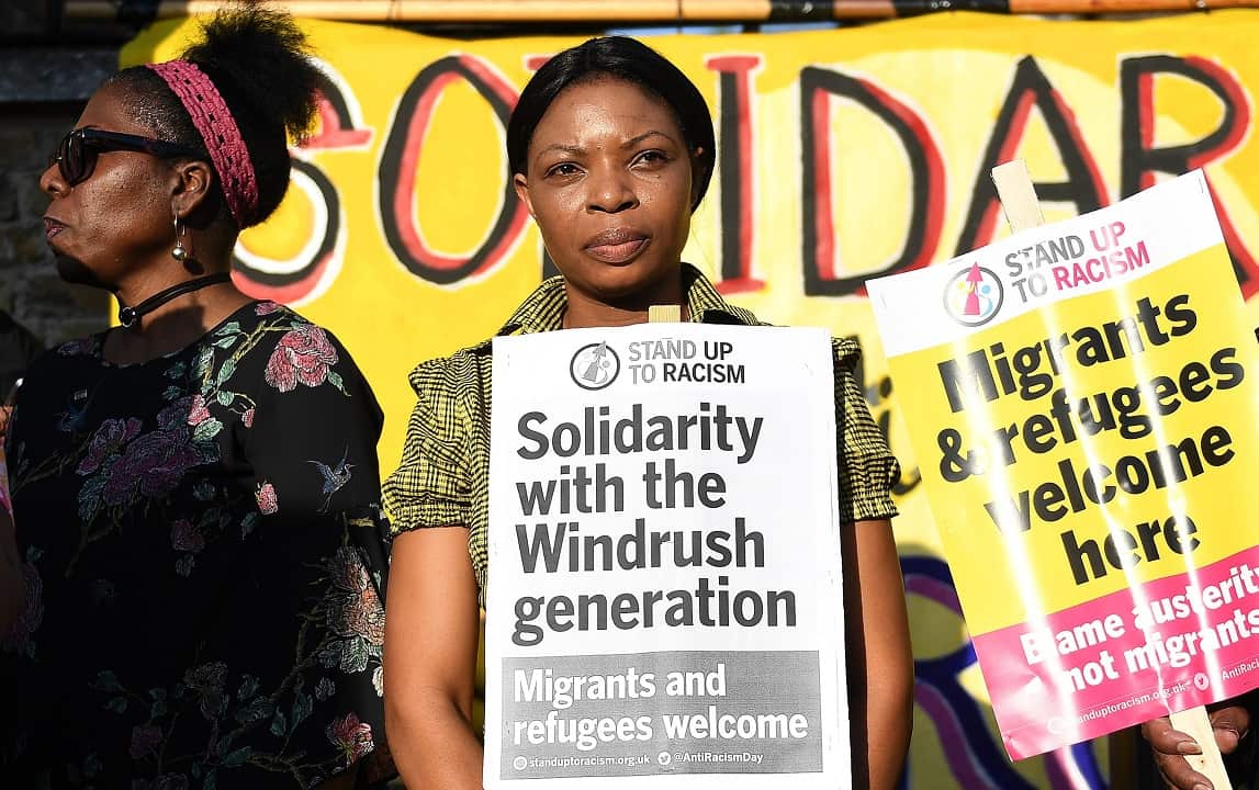 People gather for a Windrush generation solidarity protest in Brixton, London.