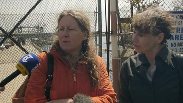 MJ Adams (left) speaks to the media after finally being able to visit the island where her son is buried.
