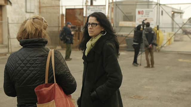 Bereaved mother Laurie Grant waits at the Department of Correction dock, from where visitors travel to Hart Island.