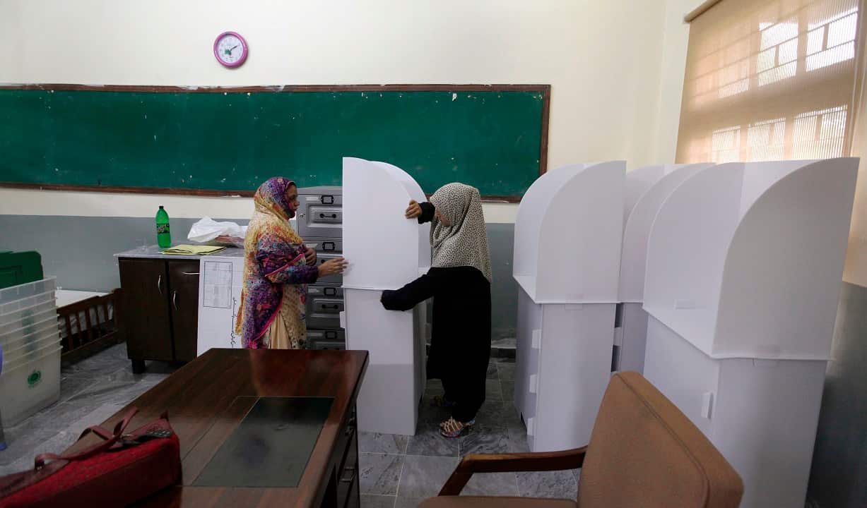 Pakistani election staff prepare election material ahead of voting.