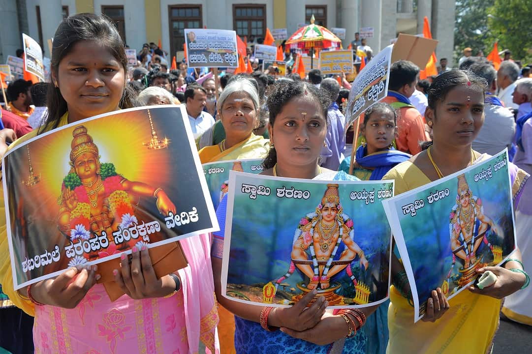 Devotees of Hindu god Ayyappa call for a reversal of a Supreme Court decision to allow women of "menstruating age" into the Sabarimala Temple.
