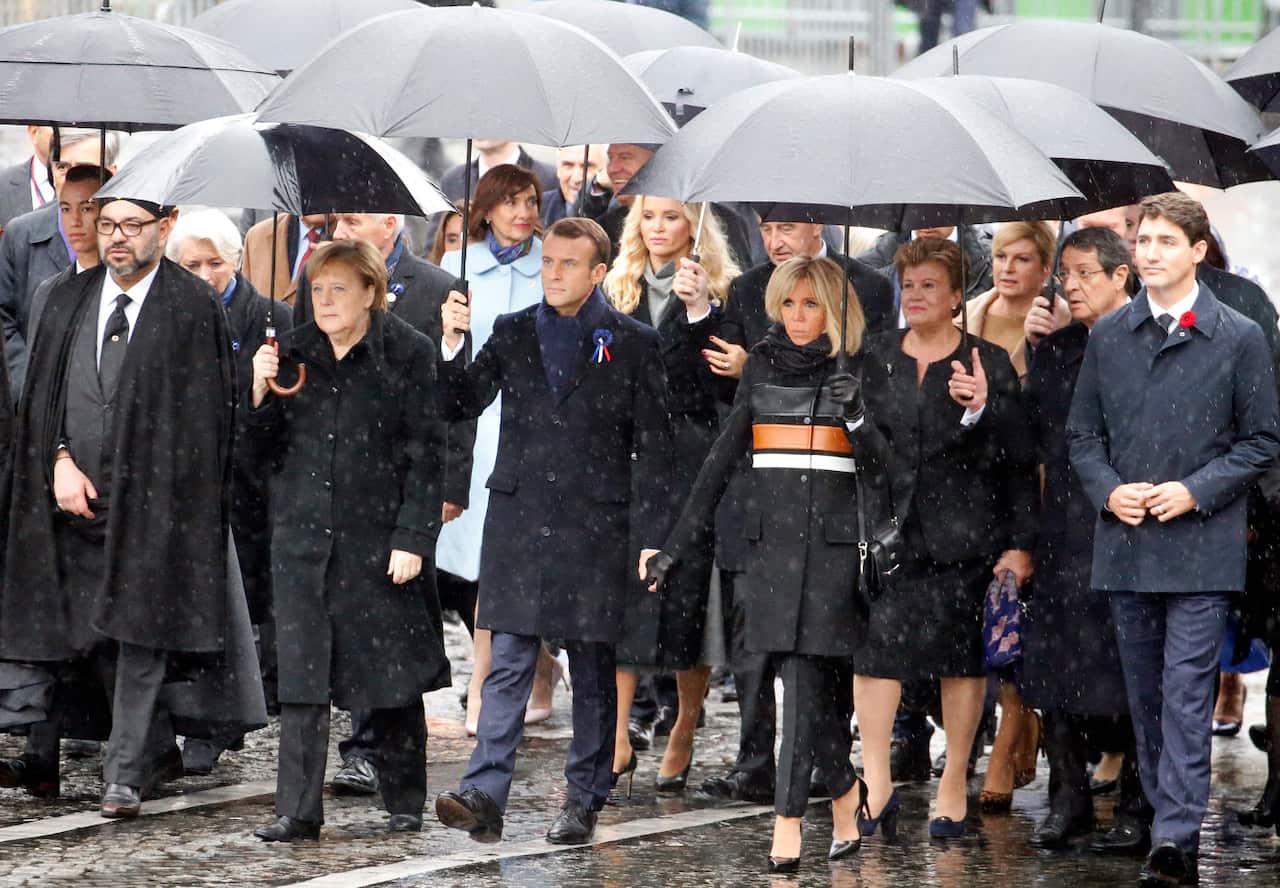 (L-R) Prince Moulay El Hassan, King of Marocco Mohammed VI, German Chancellor Angela Merkel, French President Emmanuel Macron, his wife Brigitte Macron and Canada's Prime Minister Justin Trudeau arrive to attend the international ceremony of the Armistic