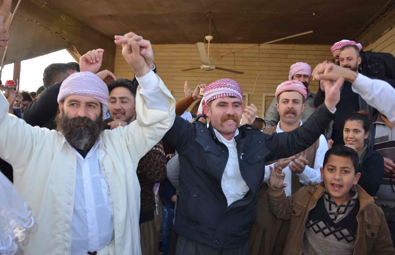 Iraqi Yazidis visit their temple during a ceremony on January 12, 2018, in the town of Bashiqa, some 20 kilometres north east of Mosul (Getty)
