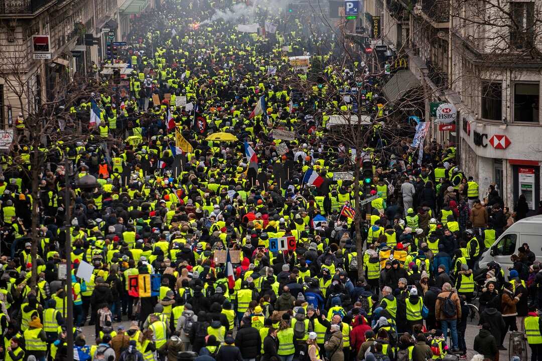 Thousands march in France despite Macron's attempts to channel their anger into a series of public debates. 