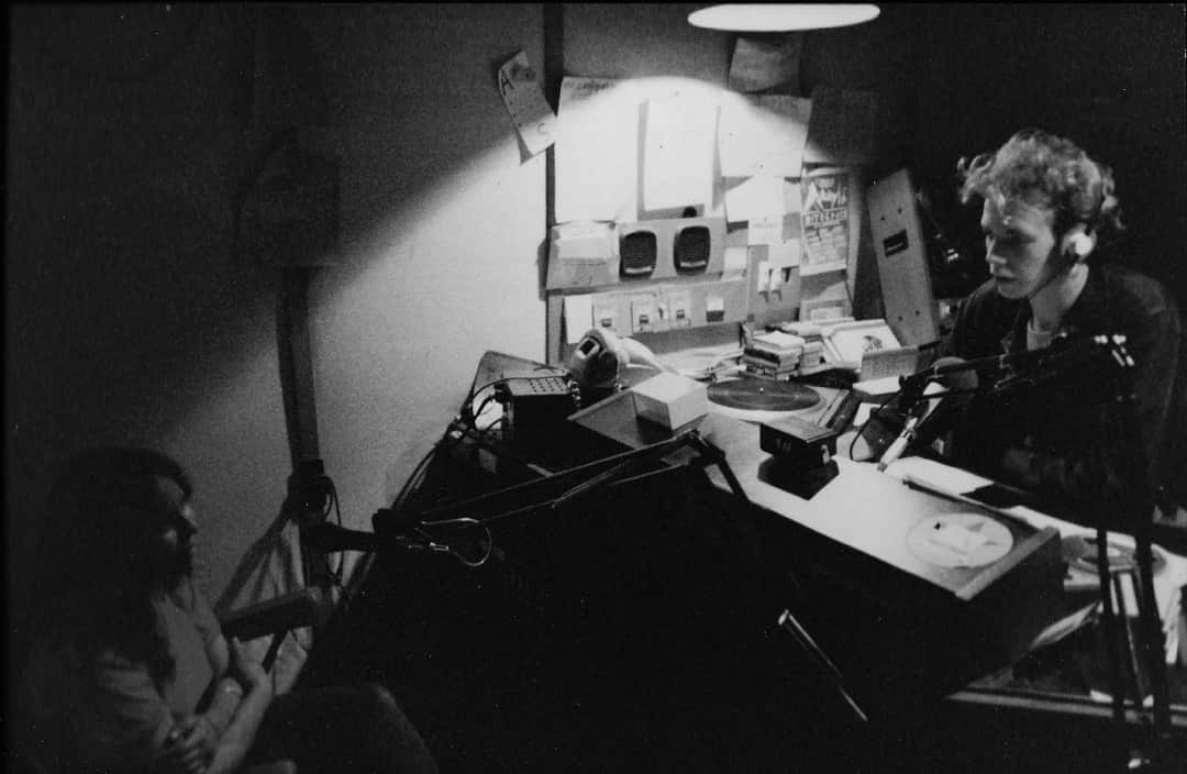 Madeline McGrady doing a live radio interview at the 4ZZZ radio station, Brisbane.
