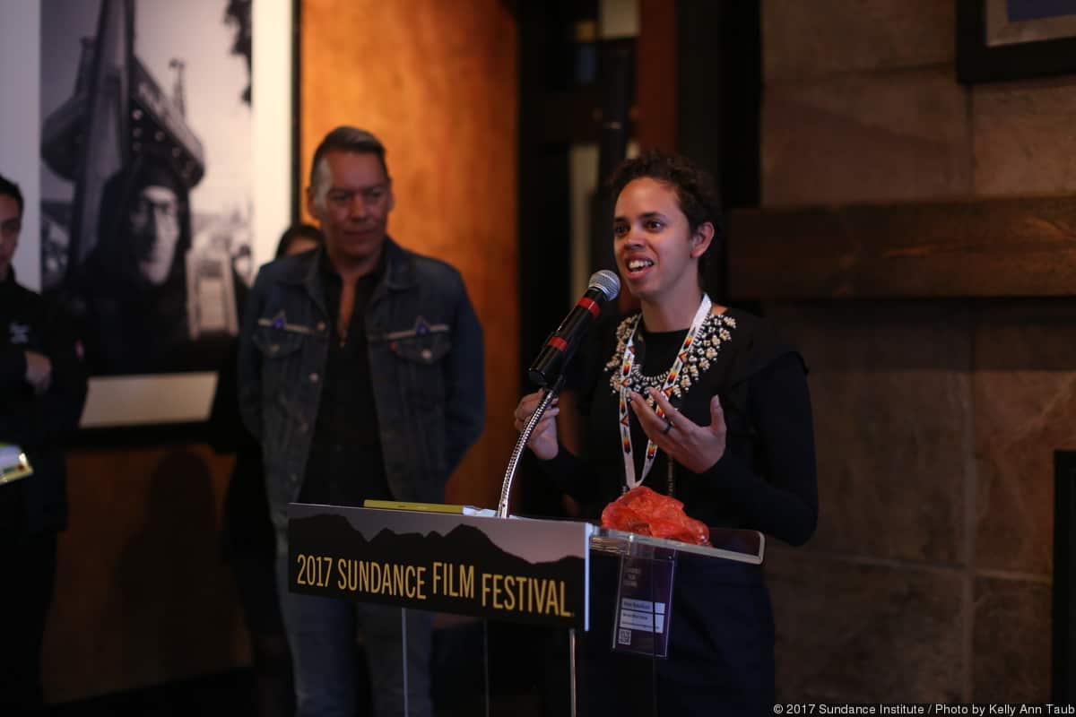 Amie Batalibasi speaks at a lecturn at the 2017 Sundance Festival