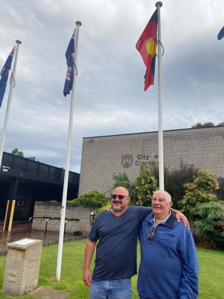 Photo of Allan and Greg Brown after raising the Aboriginal flag at the Clarence City Council