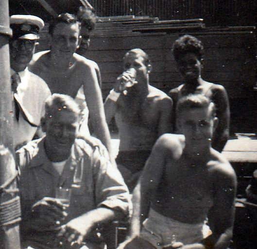 The crew of Coweambah with Farry and Tiger with a harbor officer.