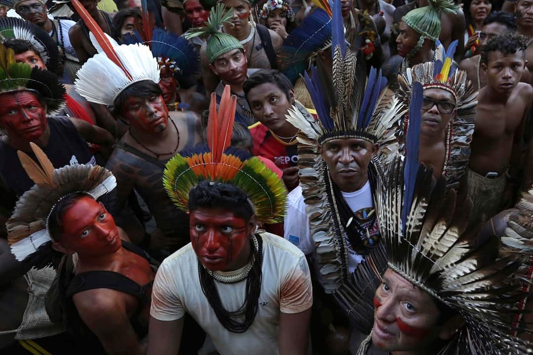 Indigenous groups holding a land rights protest in Brazil.