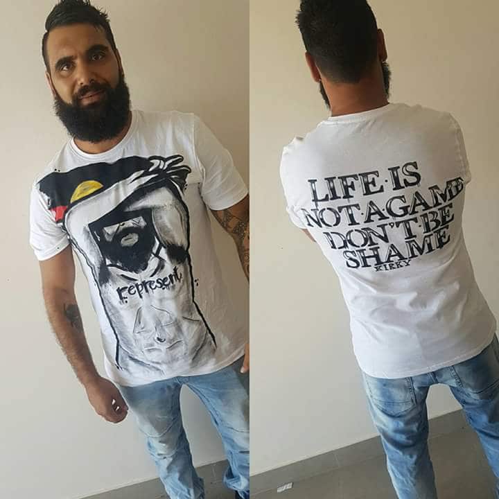 Indigenous youth worker Josh Kirk wearing t-shirts to break down the “shame” associated with suicide.