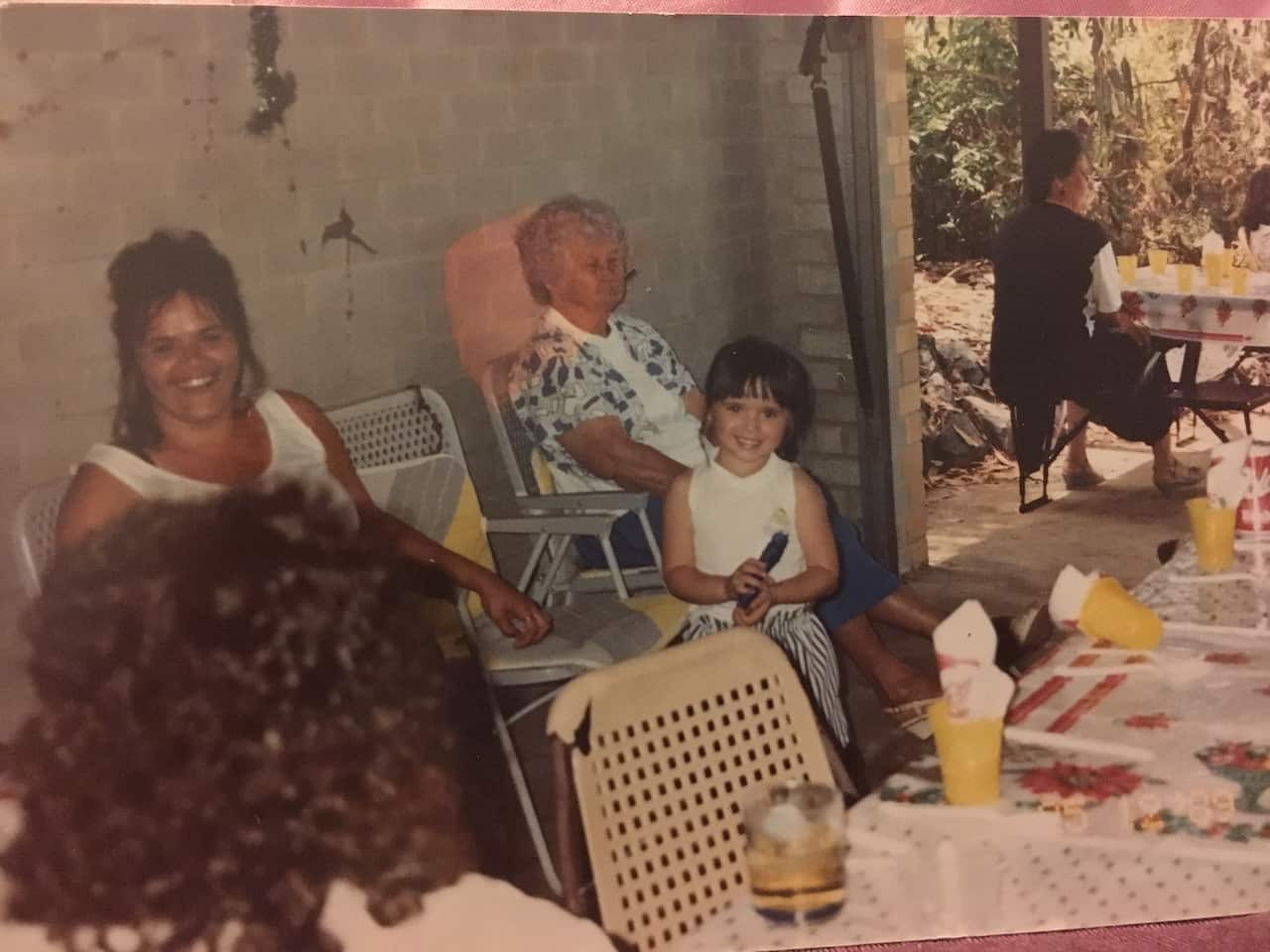 Lowanna as a young girl at family Christmas, Aunty Jo