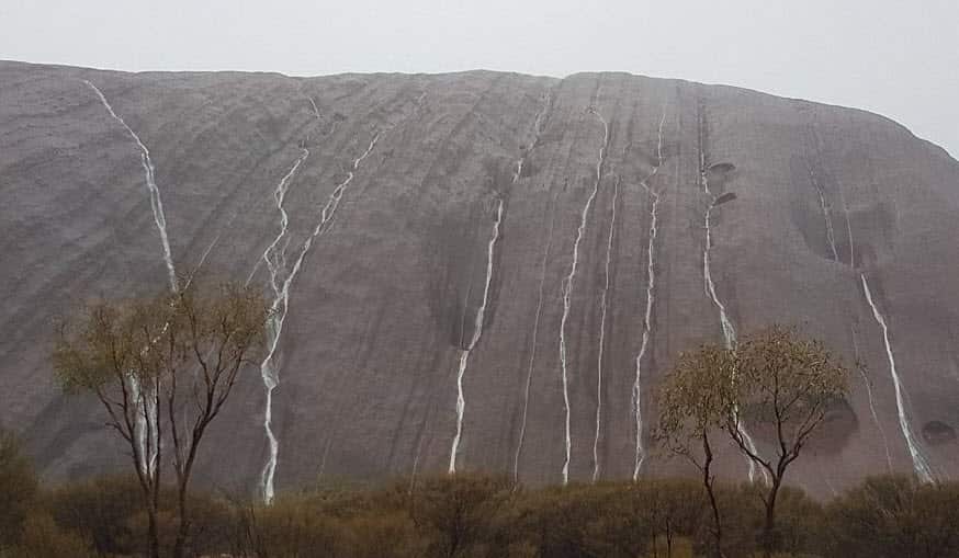 Heavy rainfall created cascading waterfalls at Uluru.
