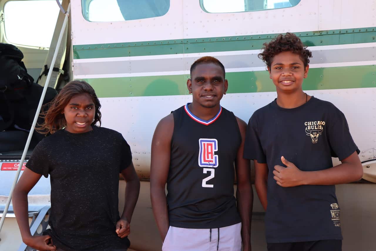 photo_taken_by_kearyn_cox_of_hamish_and_two_other_students_boarding_plane_back_to_perth.jpg