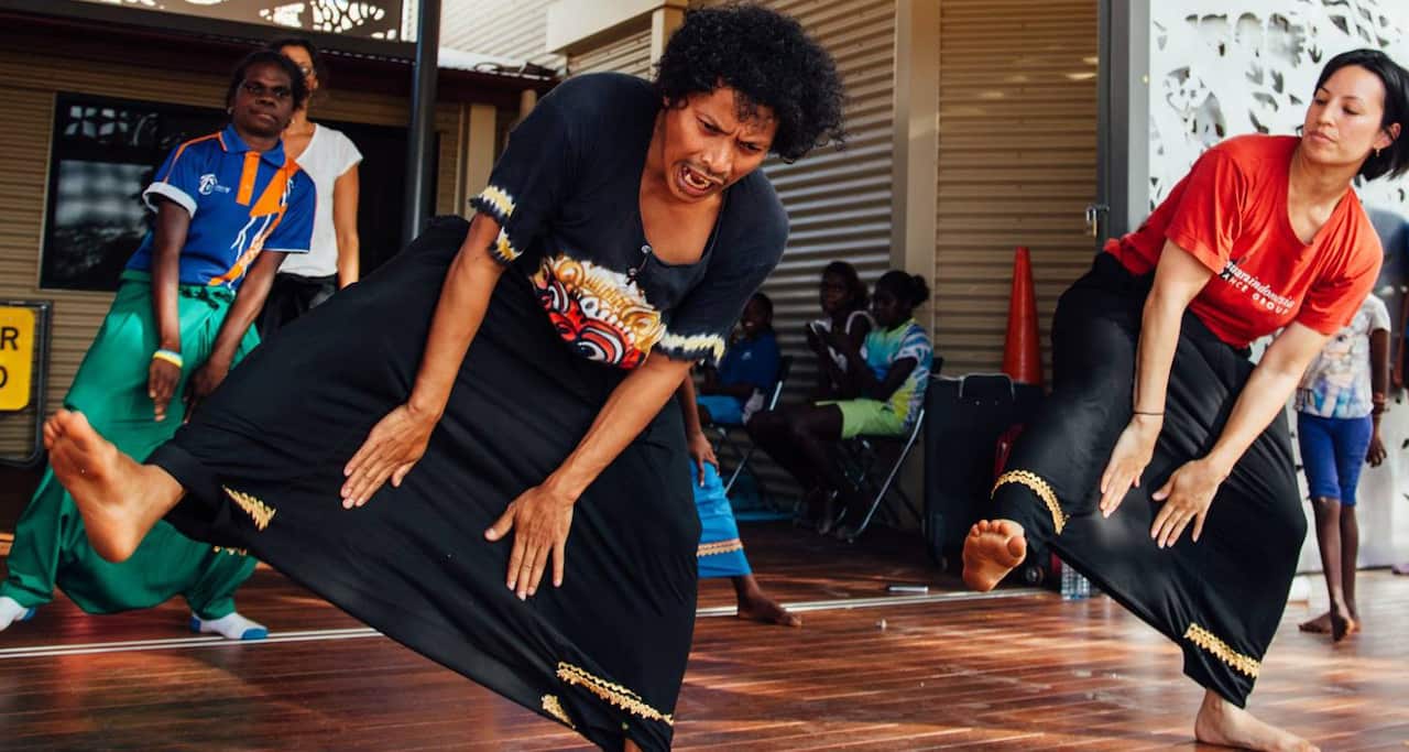 Murtala (front) shares Indonesia's Randai dance from West Sumatra with Yolngu children