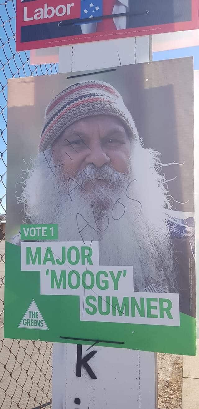 Campaign poster for Major 'Moogy' Sumner defaced with racist slogan.