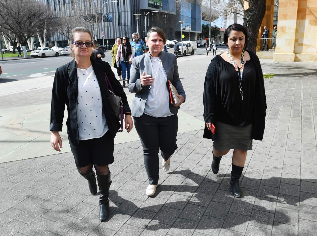 Mother of Wayne Morrison, Caroline Andersen (centre) is seen outside the Magistrates court in Adelaide, Tuesday August 28, 2018. (AAP Image/David Mariuz)