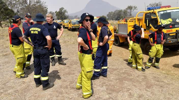 Rural firefighters are seen preparing to fight fires at Spicers Gap, south west of Brisbane, Wednesday, November 13, 2019. A number of homes have been destroyed by bushfires in New South Wales and Queensland. (AAP Image/Darren England) NO ARCHIVING 