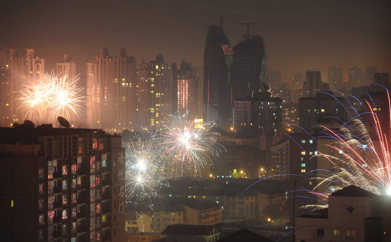 Fireworks are launched in the night sky of Beijing, China on Feb. 8, 2016, to celebrate the Lunar New Year (The Yomiuri Shimbun via AP Images)