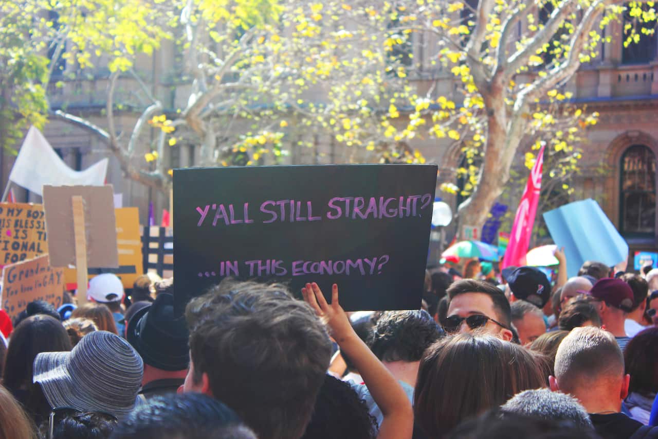'Y'all still straight?' sign at Sydney Marriage Equality rally on September 10th, 2017. (Photo: Chloe Sargeant / SBS)