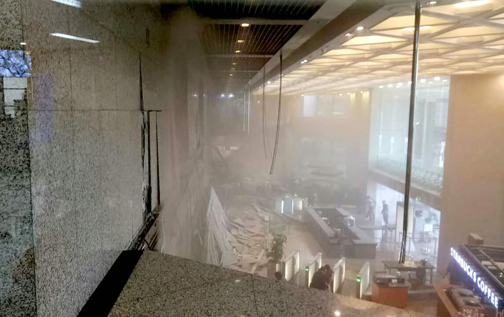 Photo received from Amailia Putri Hasniawati via WhatsApp shows dust still clouding the lobby after an internal balcony collapsed at Indonesia's stock exchange.