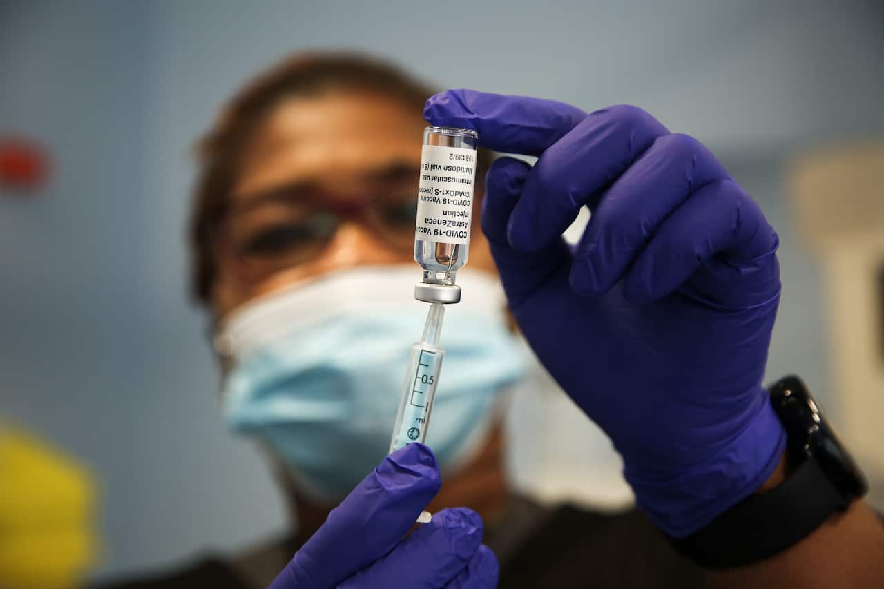 A Covid-19 vaccinator prepares to administers the Oxford/AstraZeneca Covid-19 vaccine to a member of public in London. (Photo by Dinendra Haria / SOPA Images/Sipa USA)