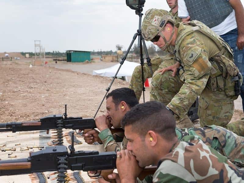 An Australian Army soldier coaches Iraqi Security Forces.
