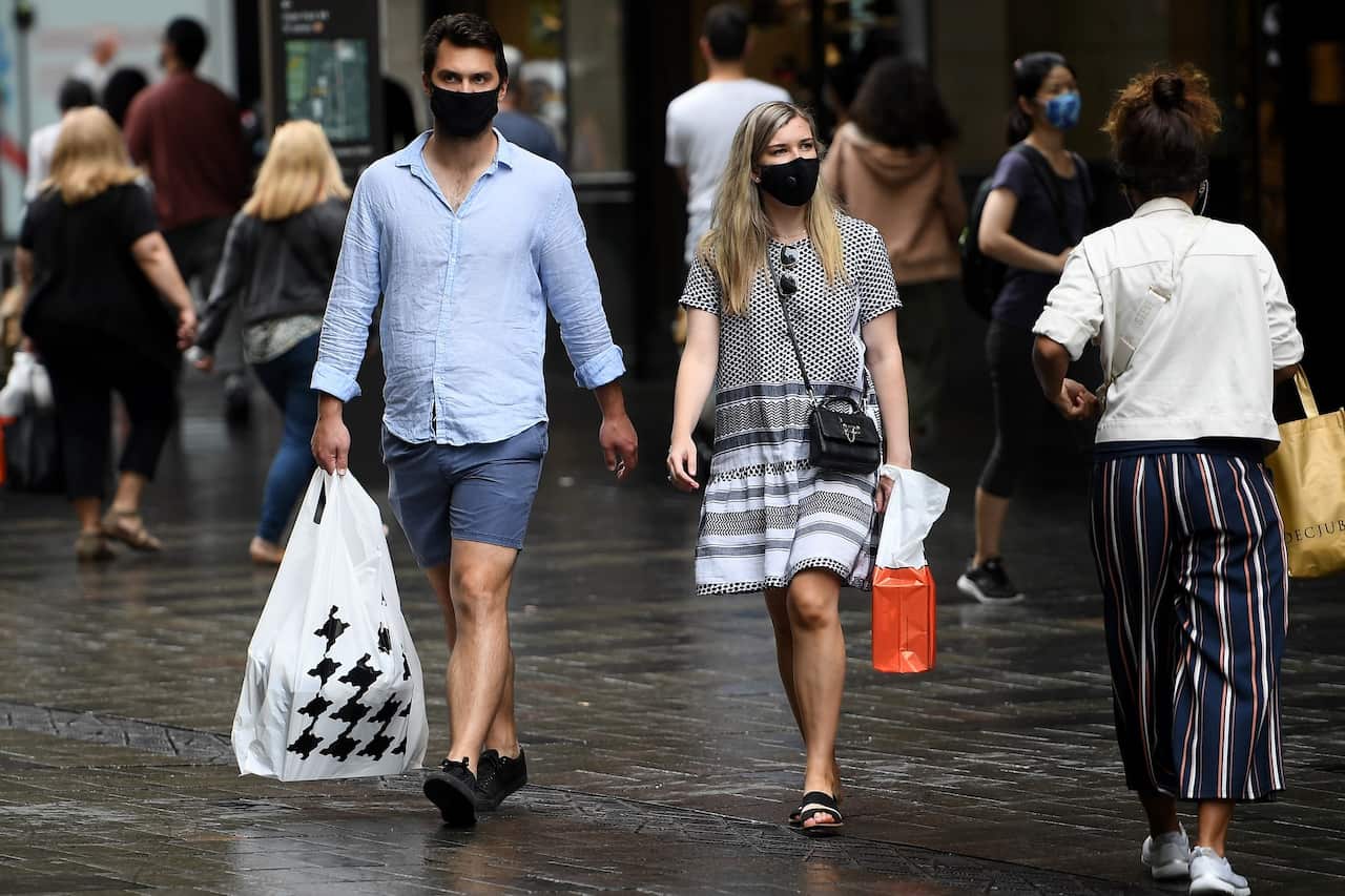 People are seen wearing masks in Sydney on 2 January, 2021. 