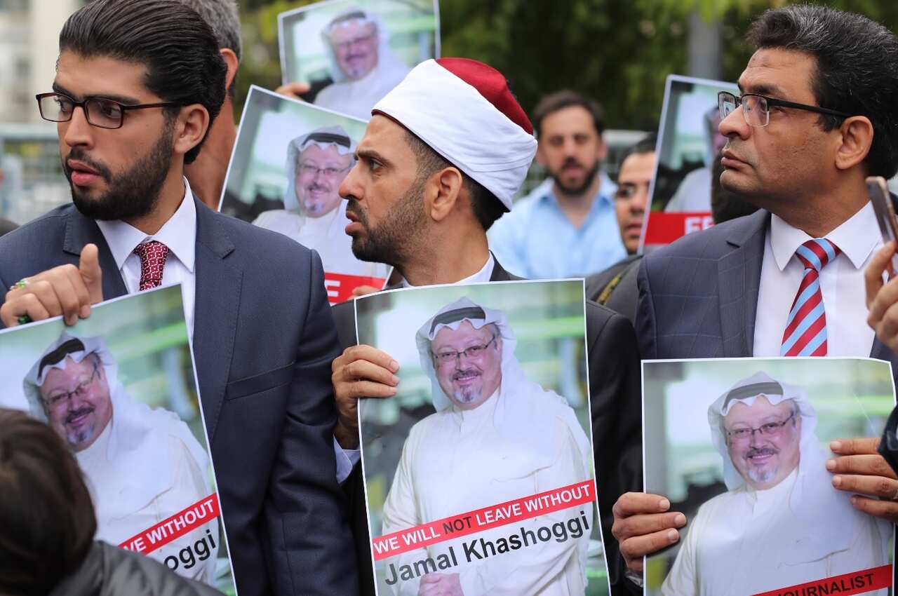 Protesters hold pictures of missing Saudi journalist Jamal Khashoggi during a demonstration organized by Turkish-Arabic Media Association 