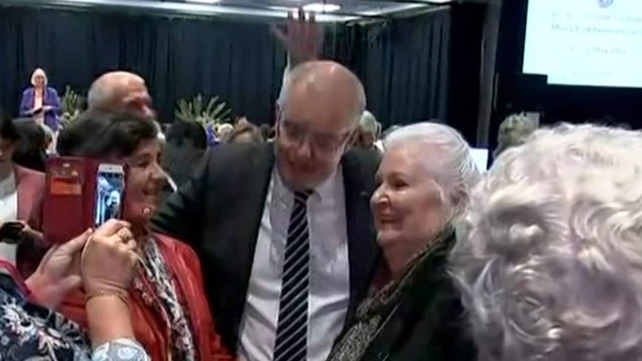 The moment a protester allegedly attempted to crack an egg on Prime Minister Scott Morrison.