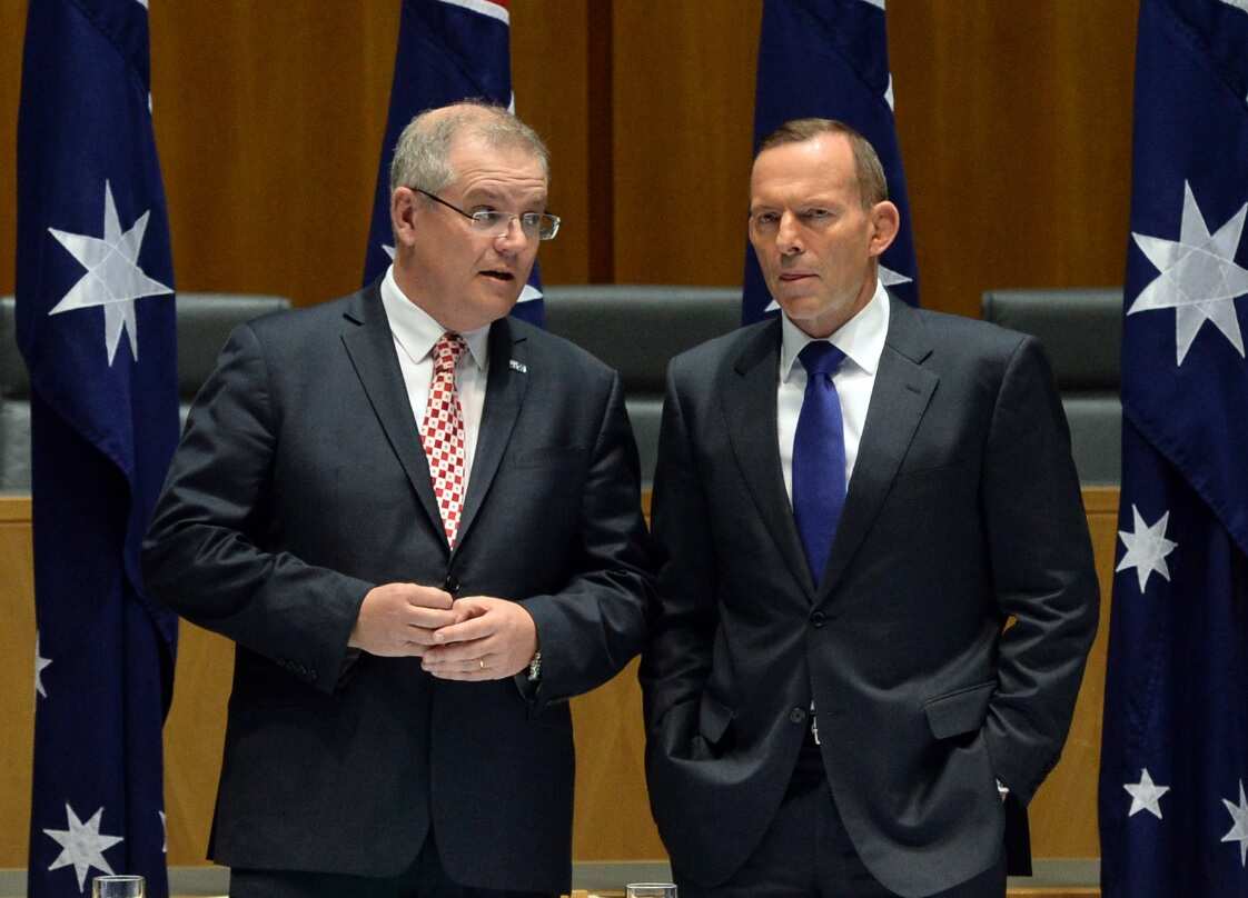 File image of then Australian Federal Social Services Minister Scott Morrison (left) and then Australian Prime Minister Tony Abbott, right.